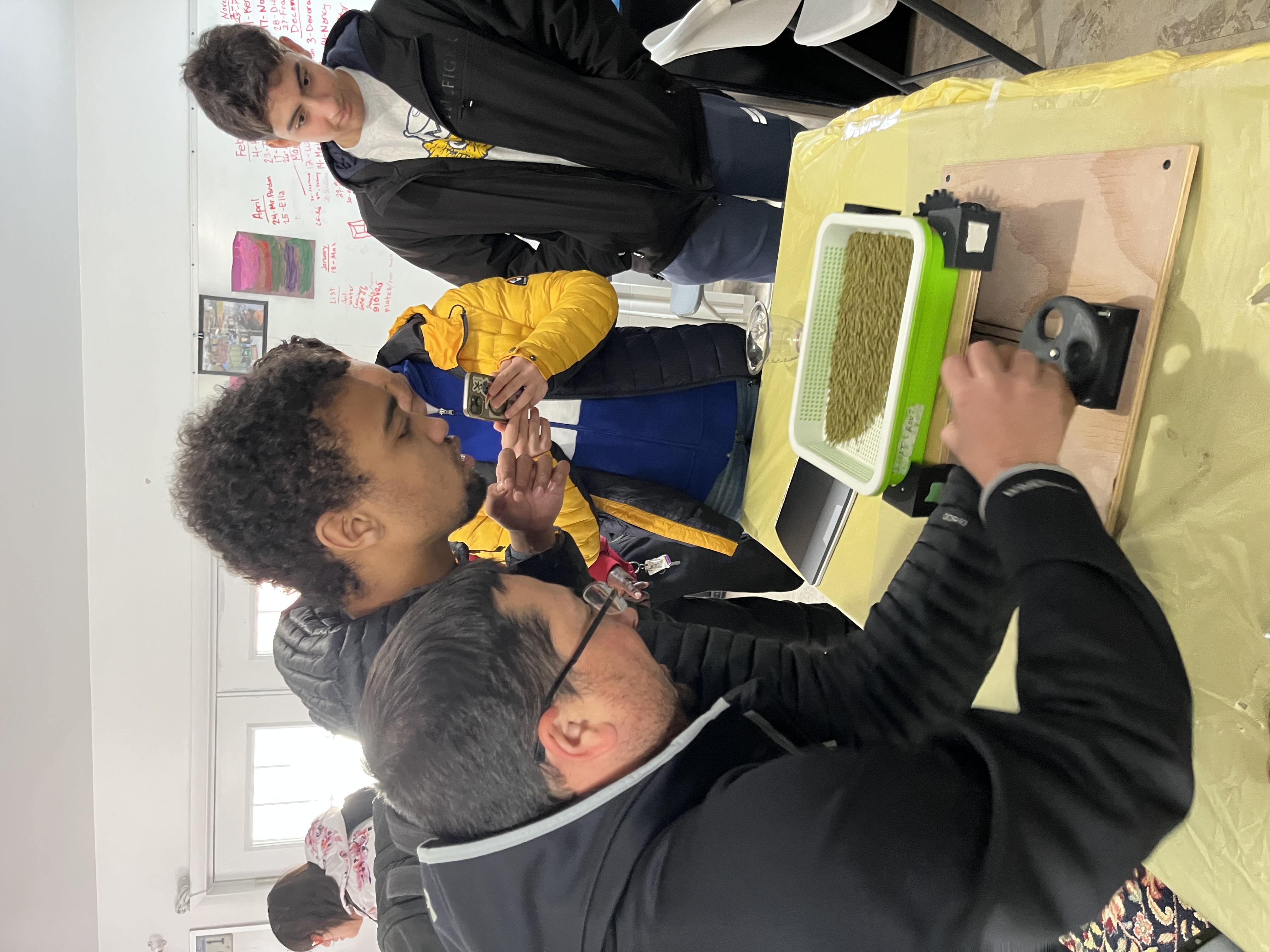 Students working on the microgreens system prototype